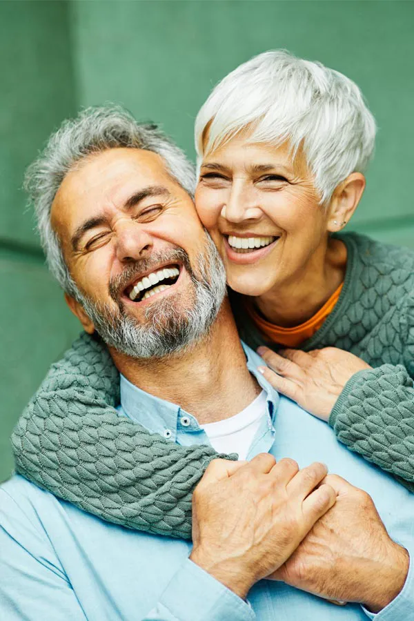 26-Day-HCG-Weight-Loss-Treatment An older healthy couple smiling and hugging. Learn about the 26-day HCG weight loss program at Jennifer Jose-Cappola, MD in Stamford.