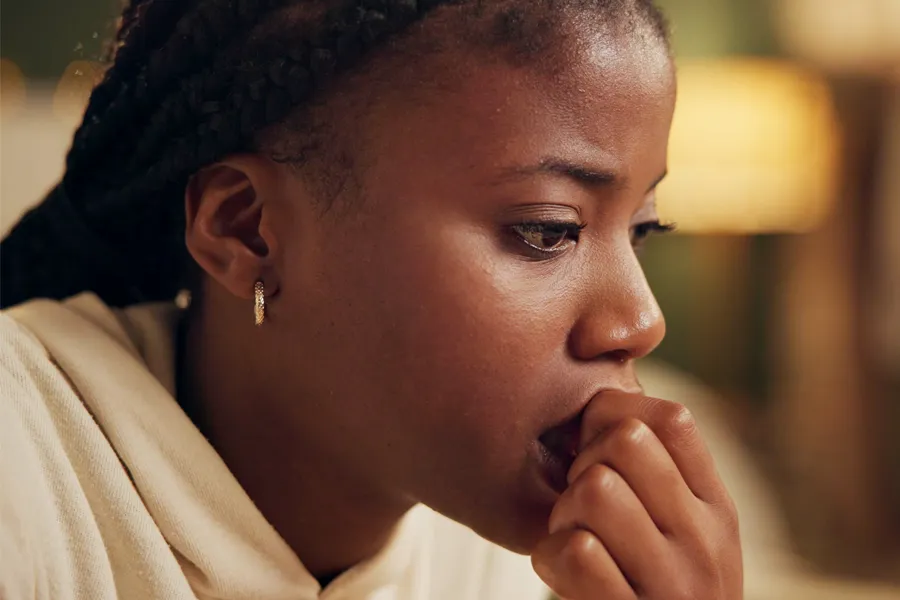 Cryotherapy-for-Mood-Imbalance-Clinic A woman bites her nails with anxiety. Get Cryotherapy for mood imbalances from Jennifer Jose-Cappola, MD in Stamford.