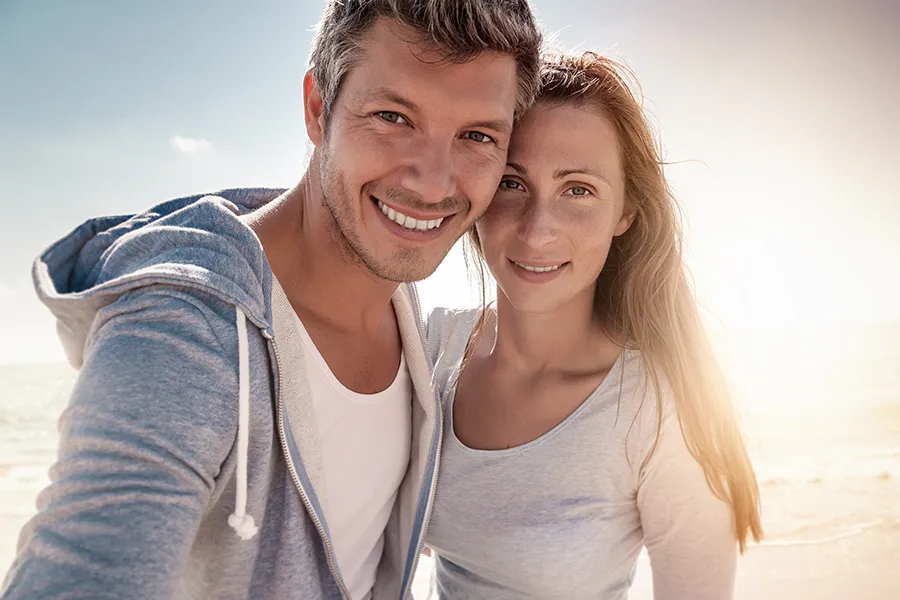 Cryotherapy-for-Skin-Health-Clinic A middle-aged couple with great skin at the beach. Schedule Cryotherapy for skin health from Jennifer Jose-Cappola, MD in Stamford.