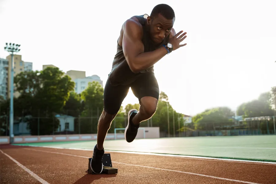 Cryotherapy-for-Sports-Recovery-Clinic A man springs off the starting block on a racing track. Schedule cryotherapy for sports performance and recovery from Jennifer Jose-Cappola, MD in Stamford.