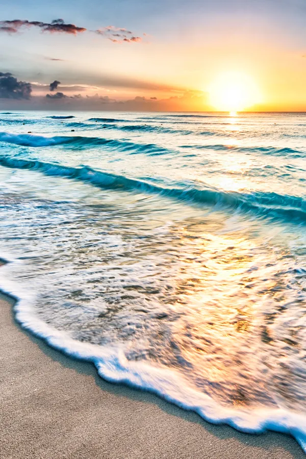 Fountain-of-Youth-IV-Drip-Treatment Ocean waves breaking on the beach at sunset. Get a Fountain of Youth IV Drip from Jennifer Jose-Cappola, MD in Stamford.