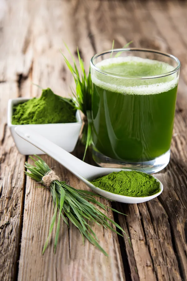 HCG-Detox-and-Cleanse-Treatment Healthy green herbs, powders and juices on a wood table. Get an HCG Detox and Cleanse treatment from Jennifer Jose-Cappola, MD in Stamford.