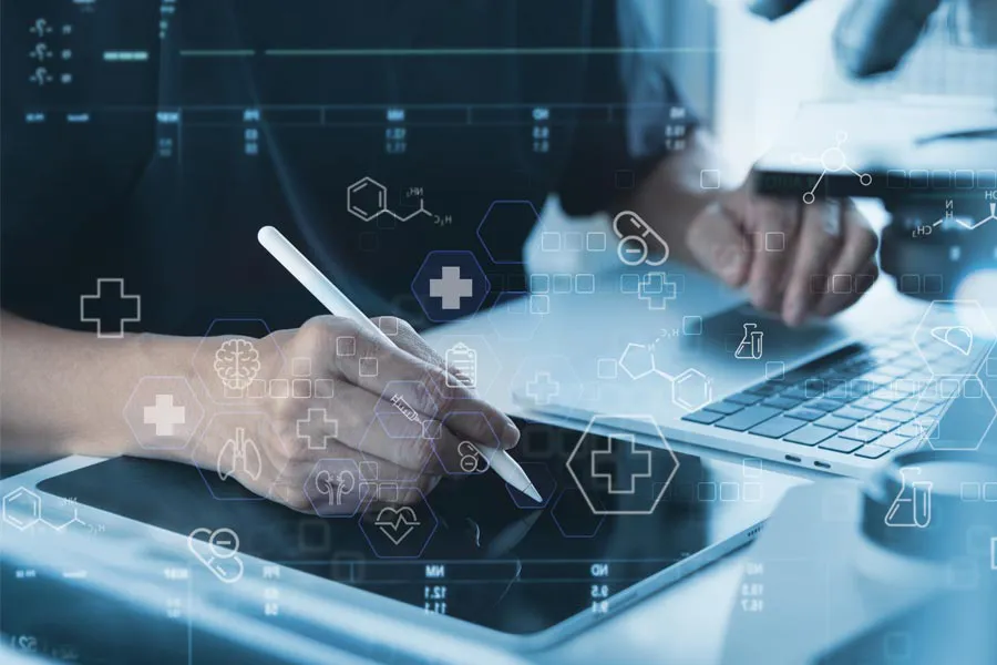 Health-Conditions-Treated-Doctor Close-up of a medical professional using a laptop and tablet, with illustrated medical symbols overlayed on the image, symbolizing health conditions treated by Jennifer Jose-Cappola, MD in Stamford.