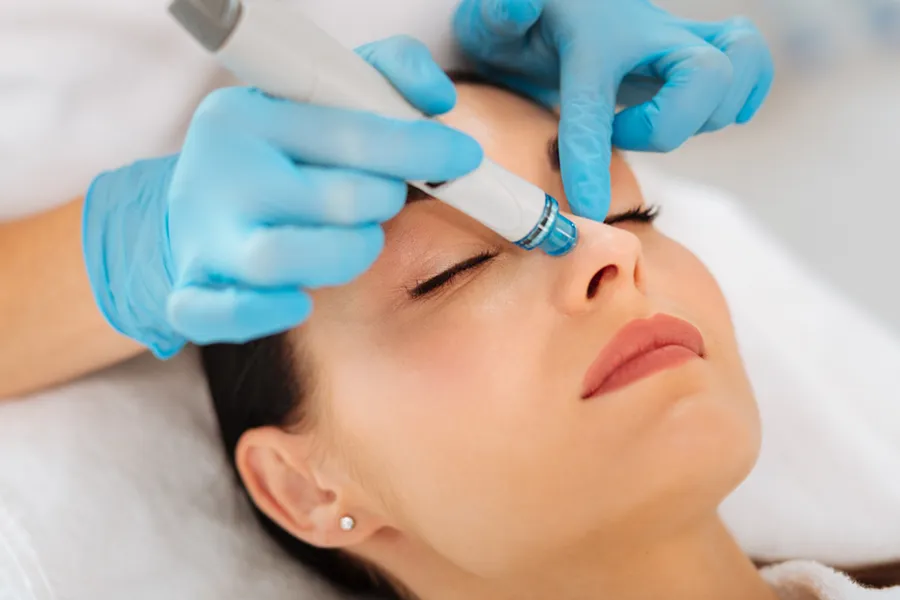 HydraFacial-Clinic A woman gets a facial treatment. Schedule a HydraFacial treatment from Jennifer Jose-Cappola, MD in Stamford.