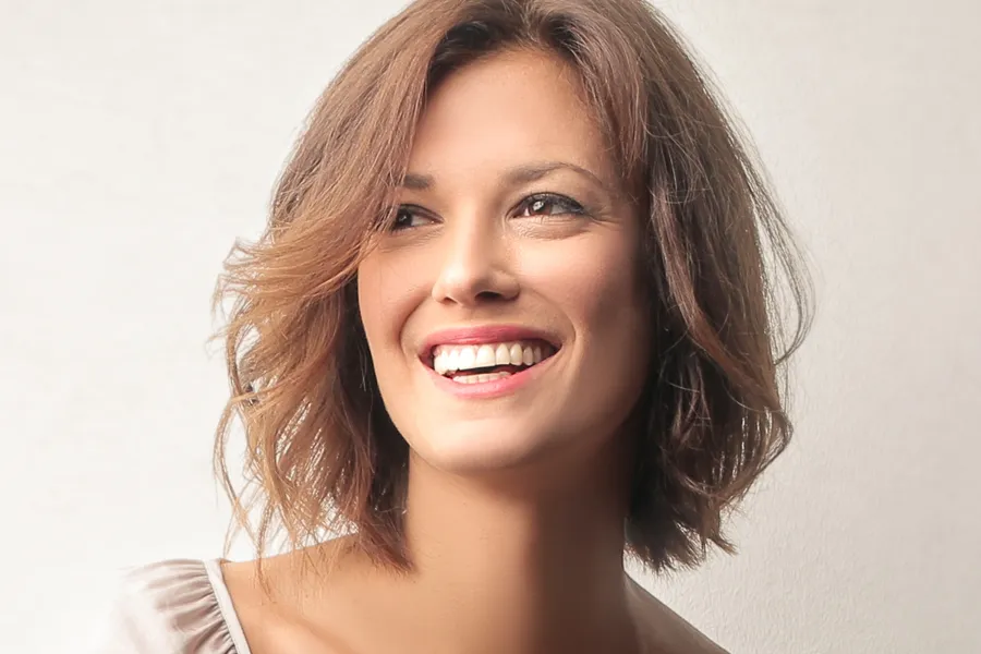 Picosure-Laser-Clinic A smiling, beautiful brown-haired woman with great skin. Schedule PicoSure laser treatment from Jennifer Jose-Cappola, MD in Stamford.